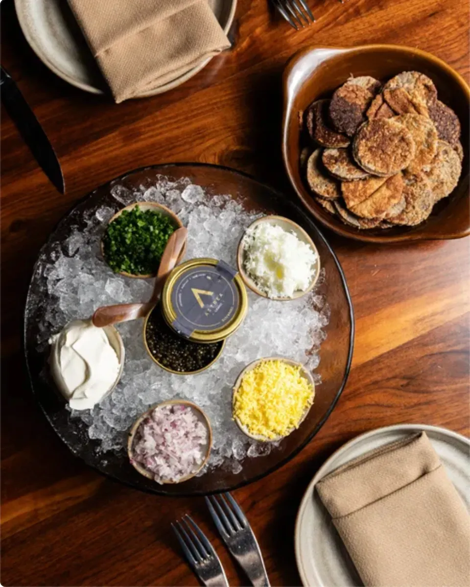 Caviar on ice with classic garnishes and blini at Arnette’s Chop Shop in Brookhaven.