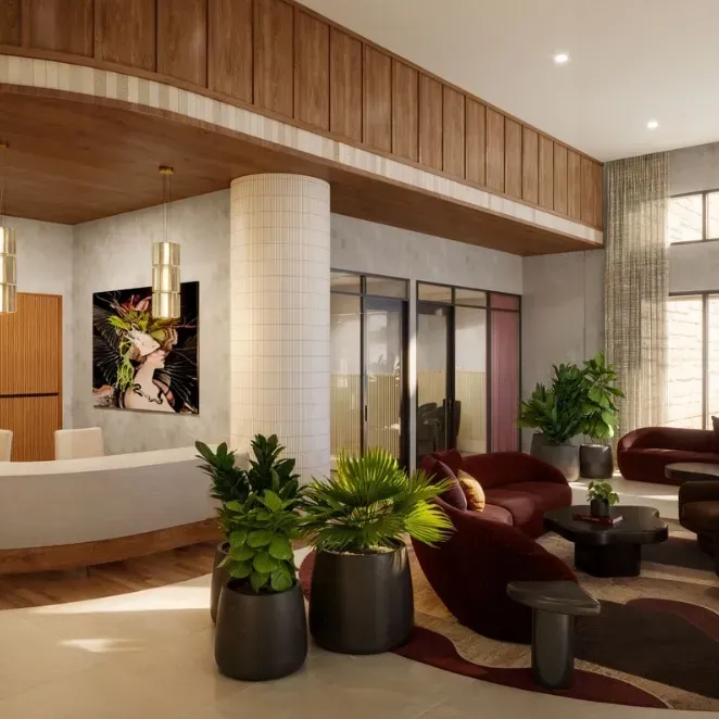 Rendering of the lobby: a curved white reception desk, brass pendants, burgundy lounge seating and potted palms beneath a wood-paneled ceiling.